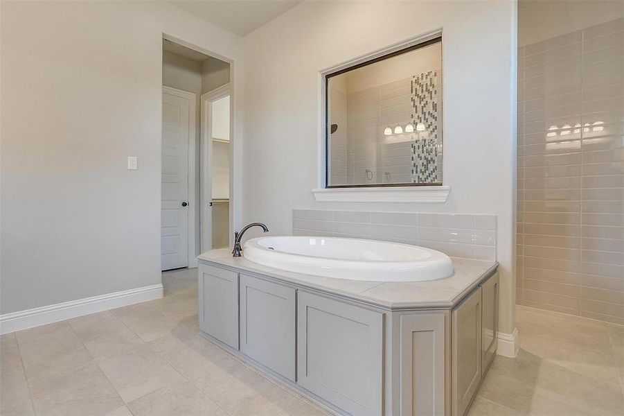 Bathroom with tile patterned flooring