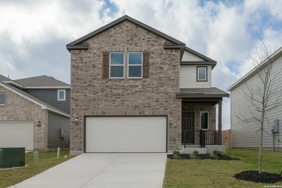 Front exterior of a new home in Hennersby Hollow, San Antonio, TX, highlighting curb appeal (Image 1). Front exterior of a new home in Hennersby Hollow, San Antonio, TX, highlighting curb appeal (Image 1).
