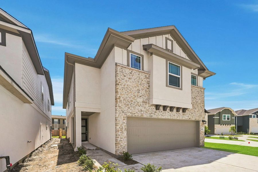 Front exterior of a new home in Park Hill Villas, Stafford, TX, highlighting curb appeal (Image 17).