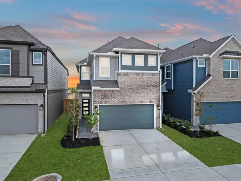 Front exterior of a new home in Bridgeland, Cypress, TX, highlighting curb appeal (Image 17). Front exterior of a new home in Bridgeland, Cypress, TX, highlighting curb appeal (Image 17).