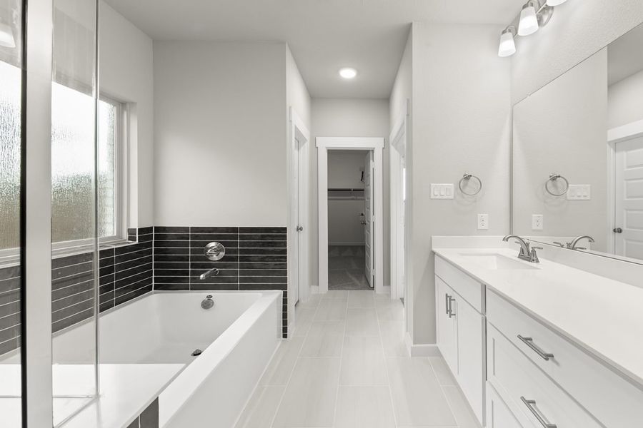 Representative furnished interior of a home built from the Hickory Sunterra 50s by Brohn Homes in Sunterra, Katy (Image 9).