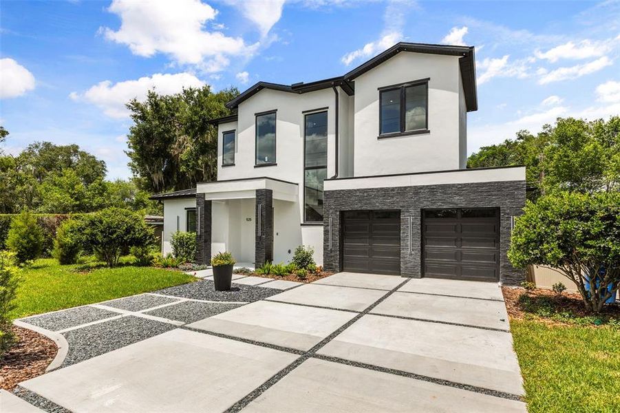 Front exterior of a new home in , Winter Park, FL, highlighting curb appeal (Image 22).