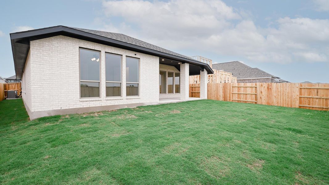 Exterior details and patio area of a home in Crosswinds, Kyle (Image 17).