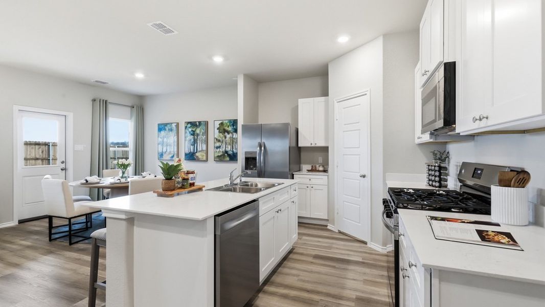 Representative furnished interior of a home built from the Plan by D.R. Horton in Bella Vista, Granbury (Image 5).