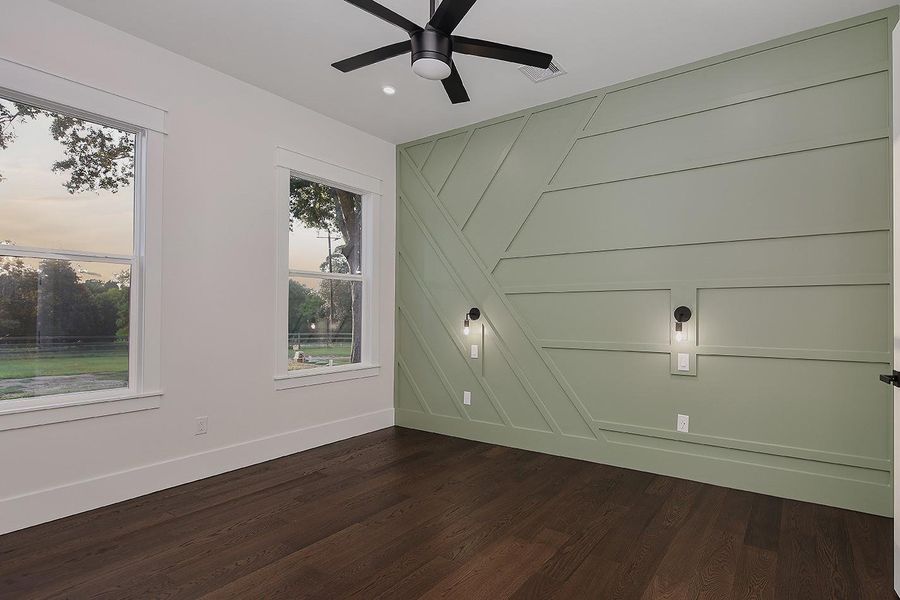 Main Floor En-suite Guest Suite Complete With Walk-In Closet and Custom Accent Wall and Lighting Main Floor En-suite Guest Suite Complete With Walk-In Closet and Custom Accent Wall and Lighting