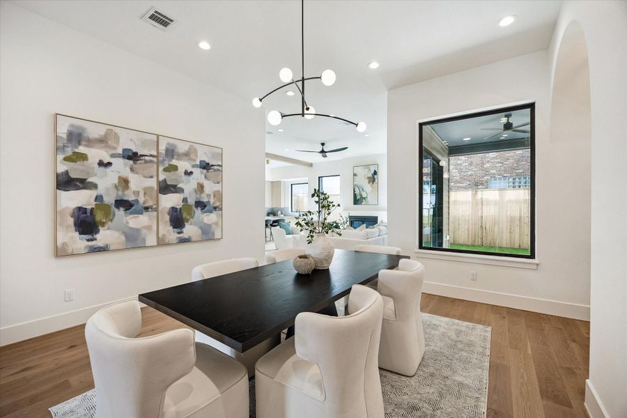 Dining area - features a designer lighting fixture and recessed lighting. Dining area - features a designer lighting fixture and recessed lighting.