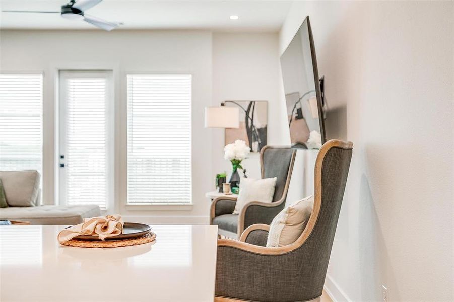 A cozy sitting area in the open living room offering an inviting place to enjoy a book or your morning coffee.