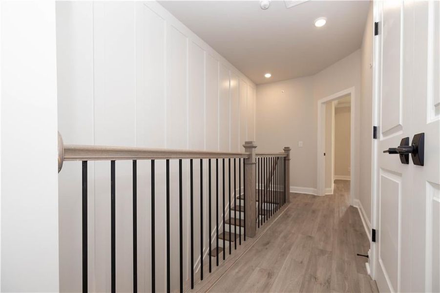 Hallway with laundry closet for ease of access for upstairs bedroom.