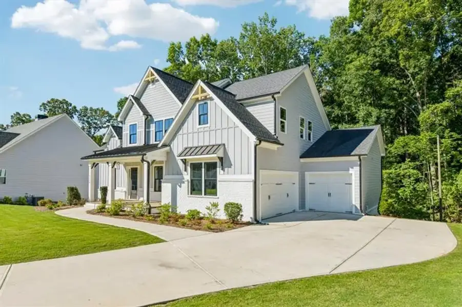 Front exterior of a new home in White Post on Lake Lanier, Gainesville, GA, highlighting curb appeal (Image 25).