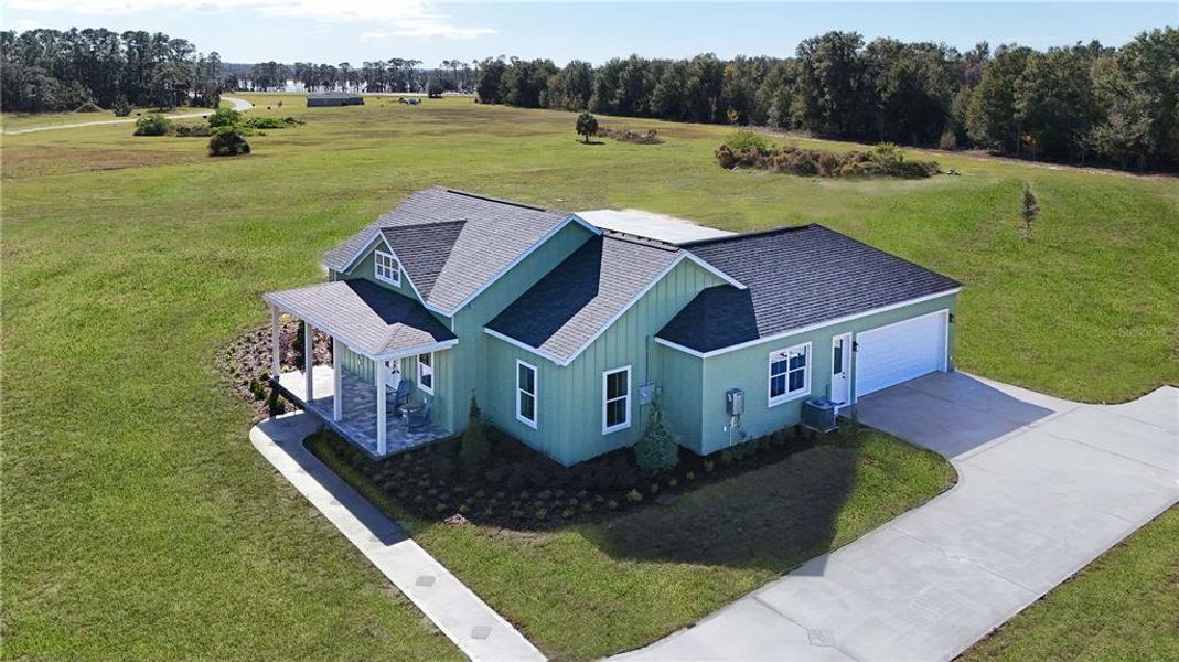 Front exterior of a new home in , Umatilla, FL, highlighting curb appeal (Image 22). Front exterior of a new home in , Umatilla, FL, highlighting curb appeal (Image 22).