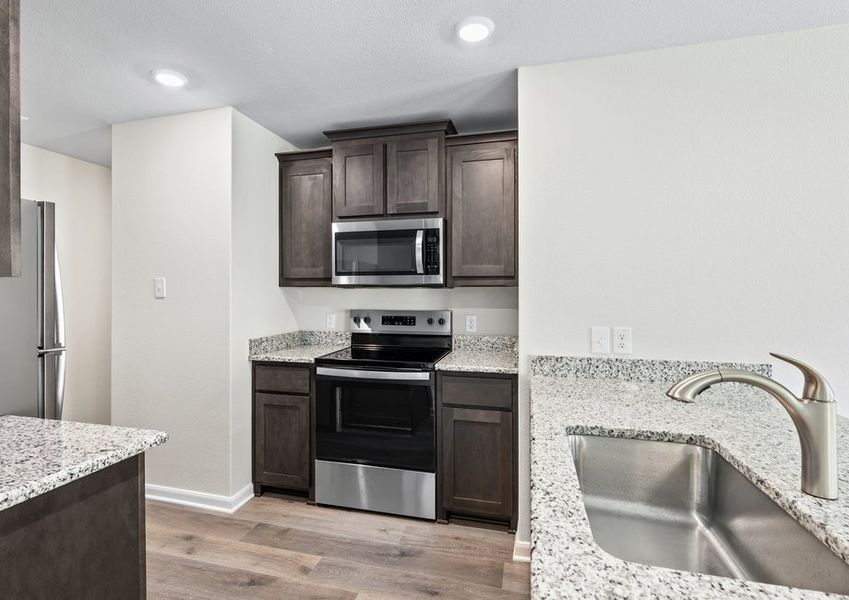 The kitchen has beautiful wood cabinetry. The kitchen has beautiful wood cabinetry.