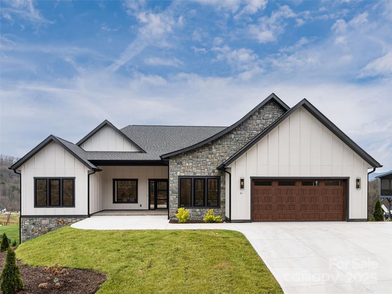 Front exterior of a new home in , Candler, NC, highlighting curb appeal (Image 27). Front exterior of a new home in , Candler, NC, highlighting curb appeal (Image 27).