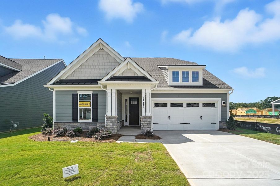Front exterior of a new home in Heritage - 55+ Community, Indian Trail, NC, highlighting curb appeal (Image 20).