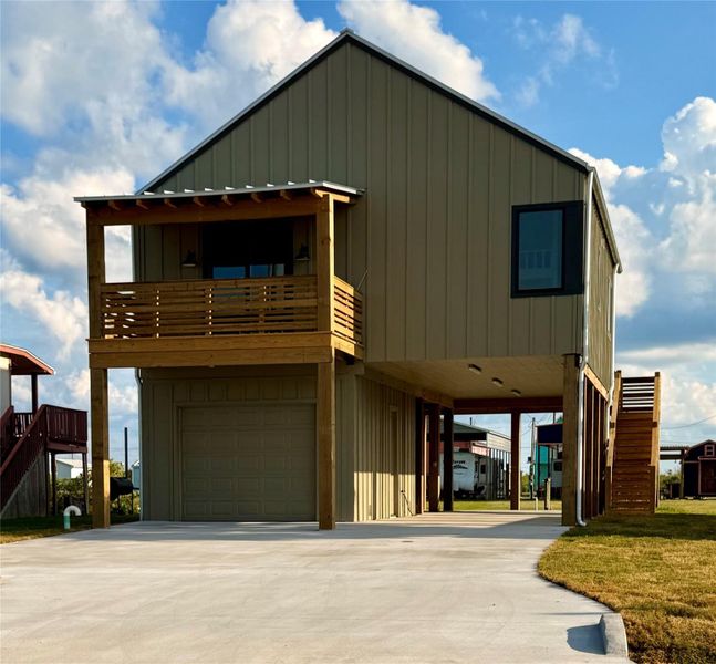 Front exterior of a new home in , Sargent, TX, highlighting curb appeal (Image 2). Front exterior of a new home in , Sargent, TX, highlighting curb appeal (Image 2).