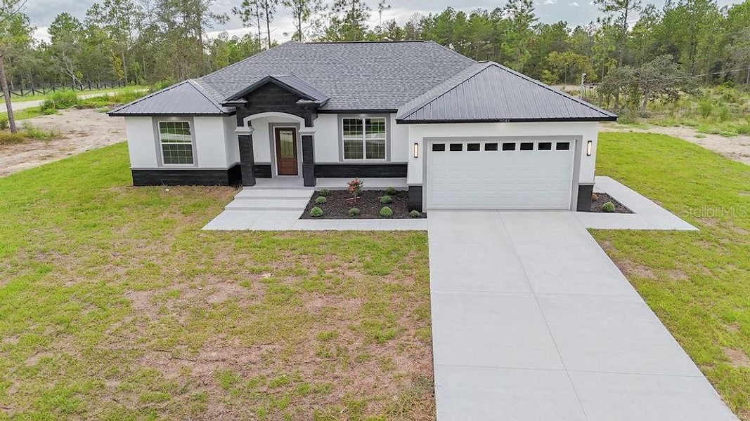 Front exterior of a new home in , Dunnellon, FL, highlighting curb appeal (Image 26). Front exterior of a new home in , Dunnellon, FL, highlighting curb appeal (Image 26).