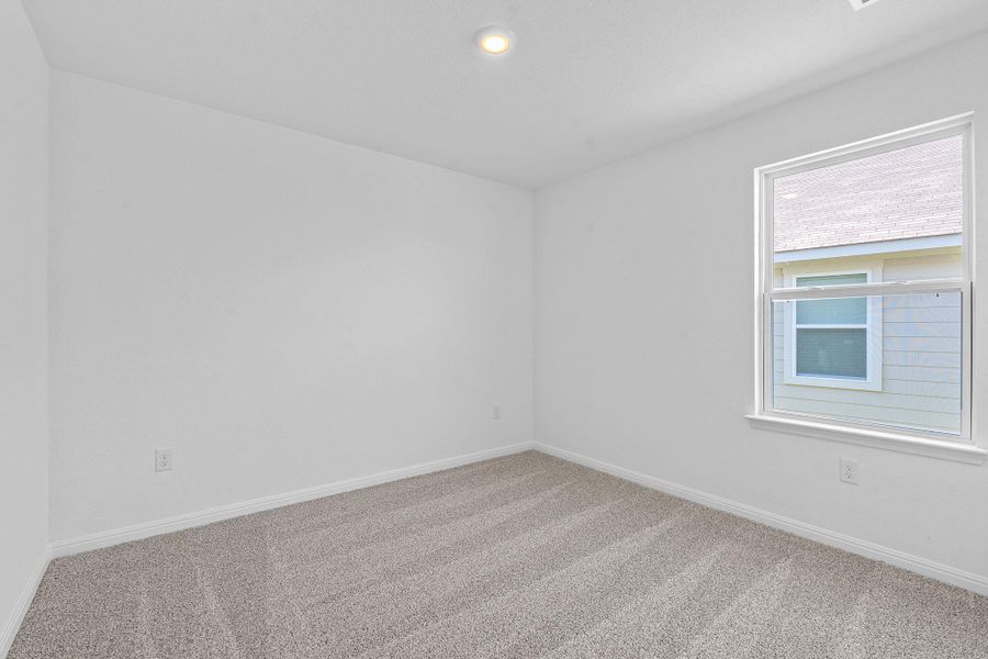 Carpeted spare room featuring baseboards and recessed lighting