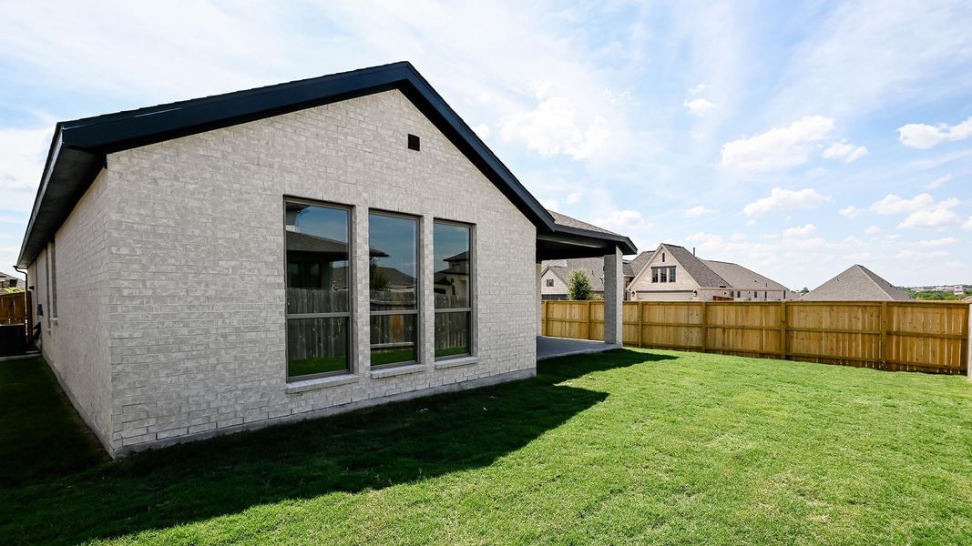Back of property with brick siding, a patio, and a residential view Back of property with brick siding, a patio, and a residential view