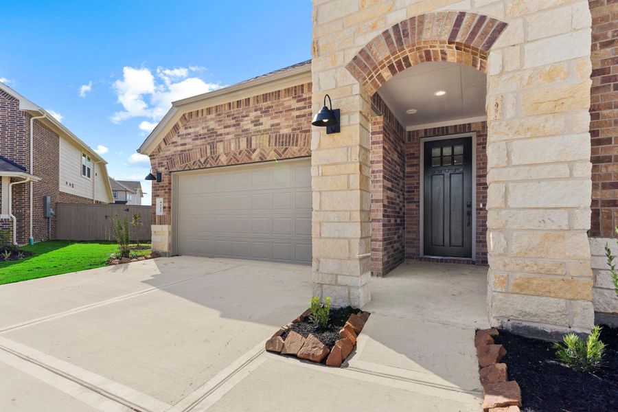 Exterior details and patio area of a home in Westland Ranch 60' Homesites, League City (Image 17).