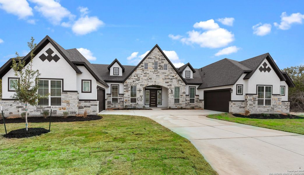 Front exterior of a new home in Potranco Oaks, Castroville, TX, highlighting curb appeal (Image 2). Front exterior of a new home in Potranco Oaks, Castroville, TX, highlighting curb appeal (Image 2).