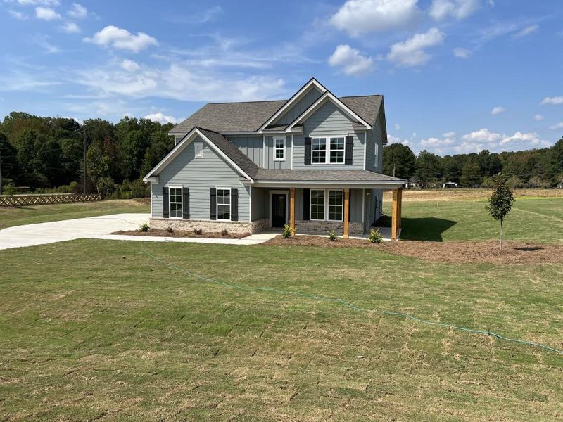 Front exterior of a new home in , Good Hope, GA, highlighting curb appeal (Image 27). Front exterior of a new home in , Good Hope, GA, highlighting curb appeal (Image 27).