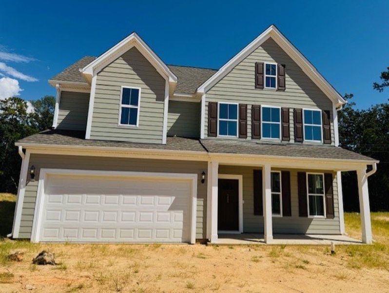 Front exterior of a new home in Pebble Branch, Chapin, SC, highlighting curb appeal (Image 1). Front exterior of a new home in Pebble Branch, Chapin, SC, highlighting curb appeal (Image 1).