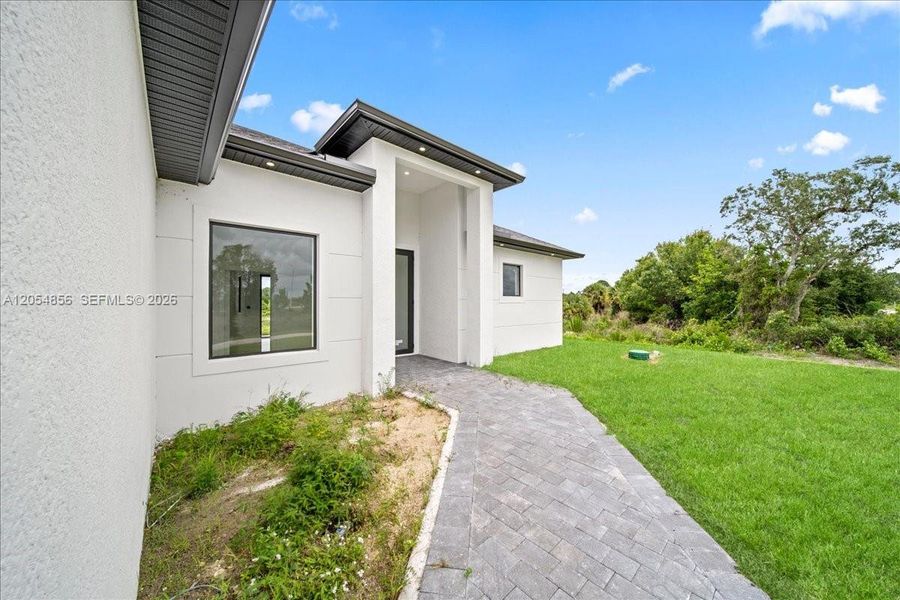 Exterior details and patio area of a home in , Lehigh Acres (Image 23). Exterior details and patio area of a home in , Lehigh Acres (Image 23).