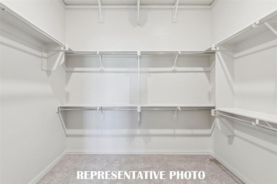 A dream owner's closet with seasonal hanging space is the cherry on top in this dreamy owner's suite!  REPRESENTATIVE PHOTO