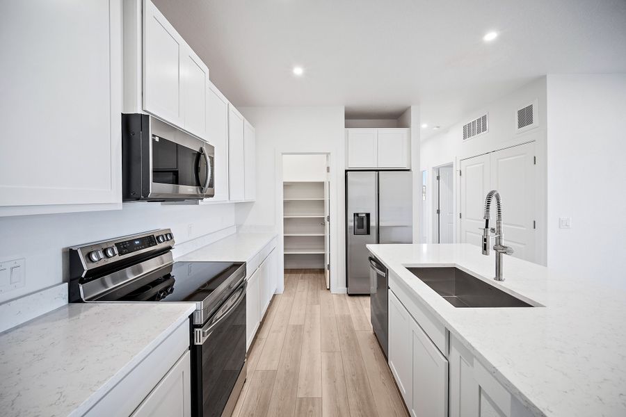 Furnished interior view inside a new home in Lyric at RidgeGate Condos, Lone Tree (Image 6).