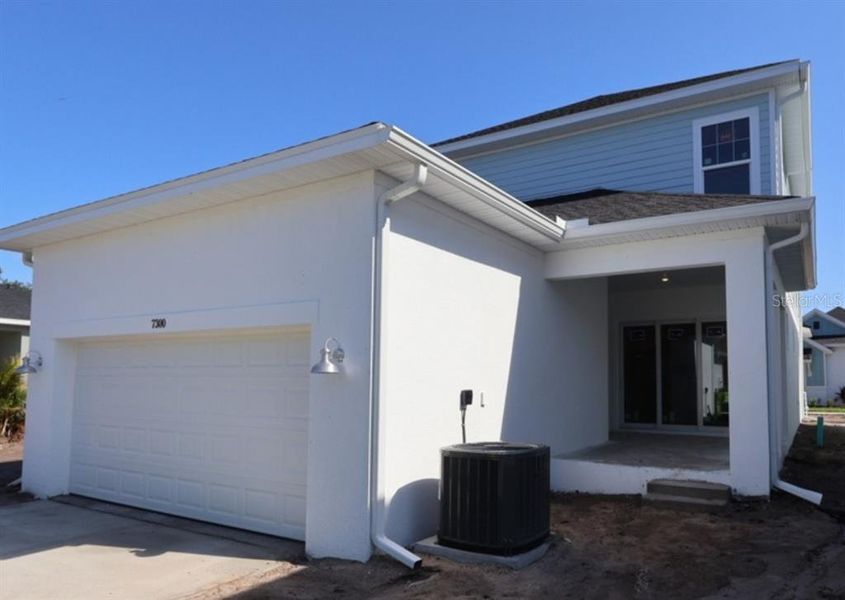 Exterior details and patio area of a home in Emerald Landing at Waterside at Lakewood Ranch – Cottage Series, Sarasota (Image 3).