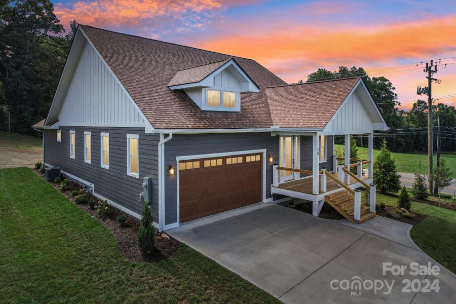 Front exterior of a new home in , Hendersonville, NC, highlighting curb appeal (Image 13).