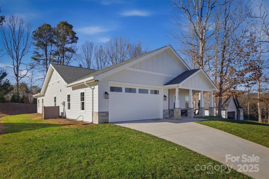 Front exterior of a new home in , Morganton, NC, highlighting curb appeal (Image 2).