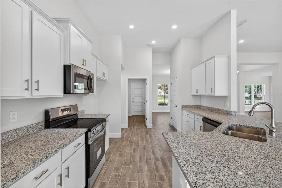 Furnished interior view inside a new home in Hill Country Estates, Dade City (Image 6).