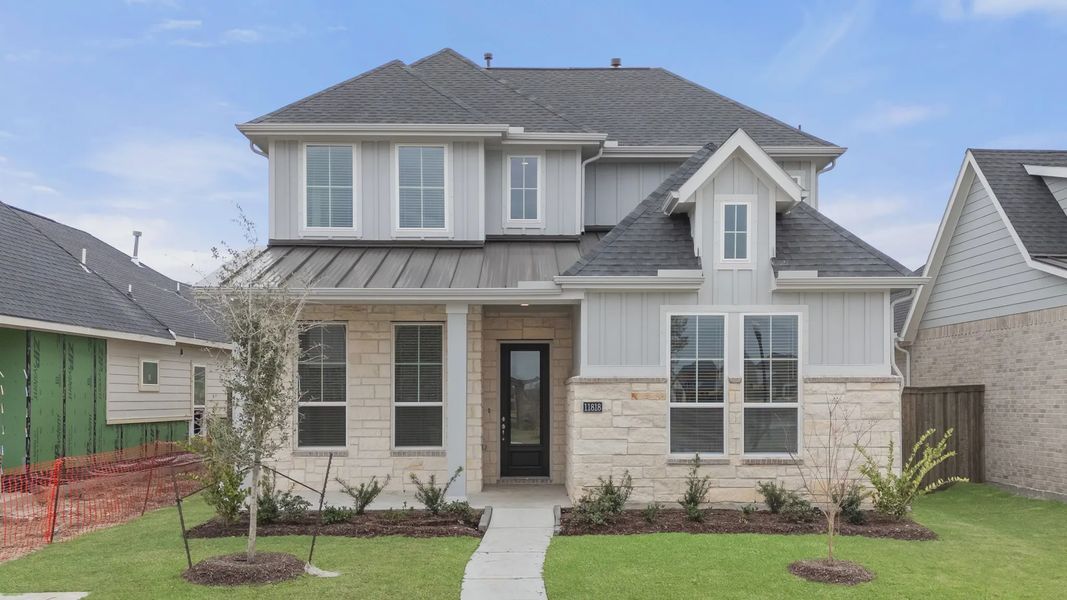 Representative exterior photo of a completed home built from the St Andrews by Chesmar Homes in Riceland Alley Loads, Mont Belvieu, TX (Image 33).