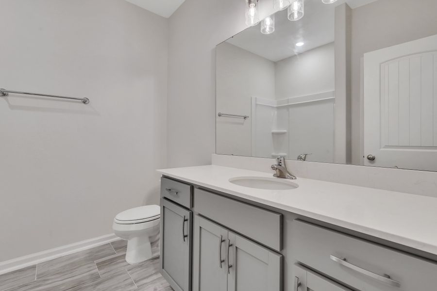 Representative furnished interior of a home built from the The Hatteras by Smith Family Homes in Ramsey Landing, Rincon (Image 12).
