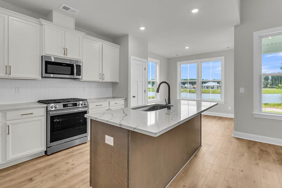 Furnished interior view inside a new home in Tidewater at Lakes of Cane Bay, Summerville (Image 5).