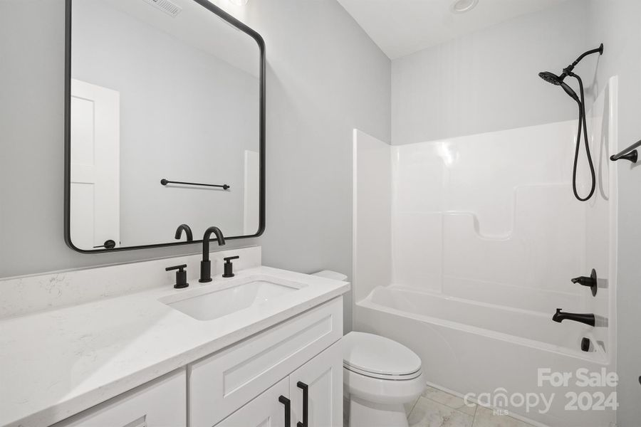 Second full bath with quartz counters and soft close drawers and cabinets