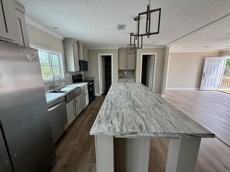 Furnished interior view inside a new home in , Okeechobee (Image 9).
