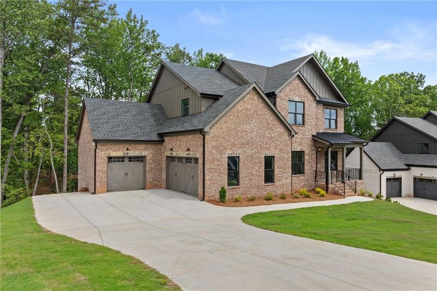 Front exterior of a new home in , Buford, GA, highlighting curb appeal (Image 24). Front exterior of a new home in , Buford, GA, highlighting curb appeal (Image 24).