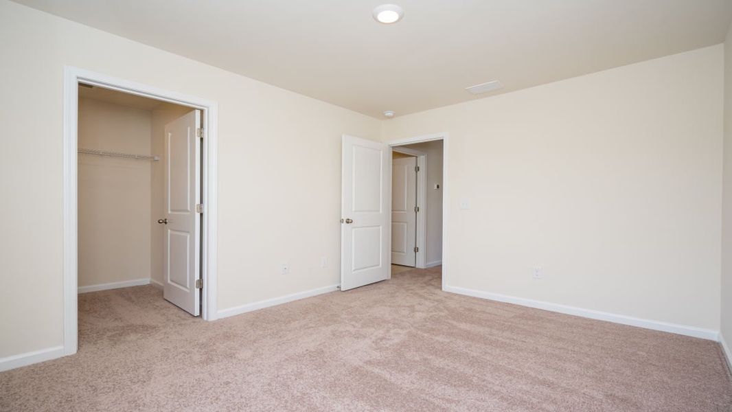 Spacious, unfurnished interior of a new home in The Pines at Blake Farm, Wilmington (Image 29).