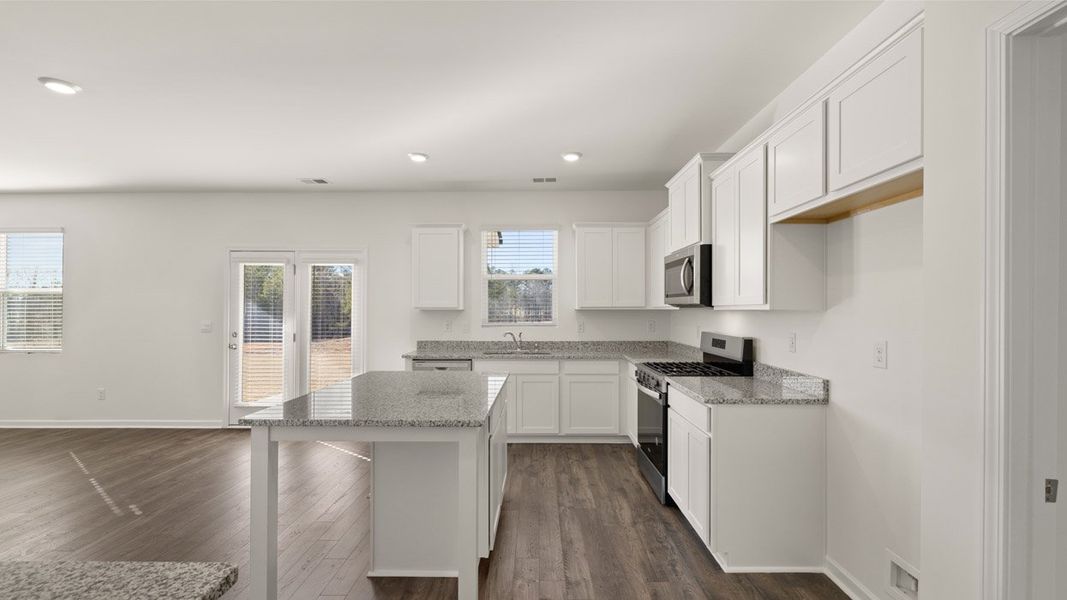 Representative furnished interior of a home built from the Mansfield by D.R. Horton in Brooks Station, Dacula (Image 8).