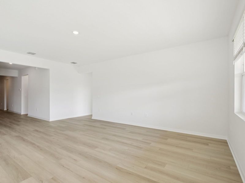 Spacious, unfurnished interior of a new home in Coasterra - Reserve Series, Palmetto (Image 13).