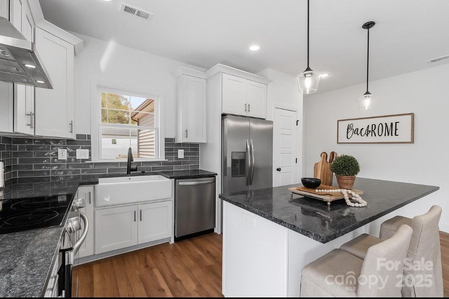 *virtually staged* kitchen complete w/ a pantry, porcelain white farmhouse sink & a hood vent! *dishwasher & fridge included *virtually staged* kitchen complete w/ a pantry, porcelain white farmhouse sink & a hood vent! *dishwasher & fridge included