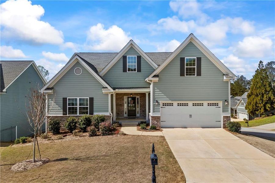 Front exterior of a new home in Traditions of Braselton, Jefferson, GA, highlighting curb appeal (Image 2). Front exterior of a new home in Traditions of Braselton, Jefferson, GA, highlighting curb appeal (Image 2).