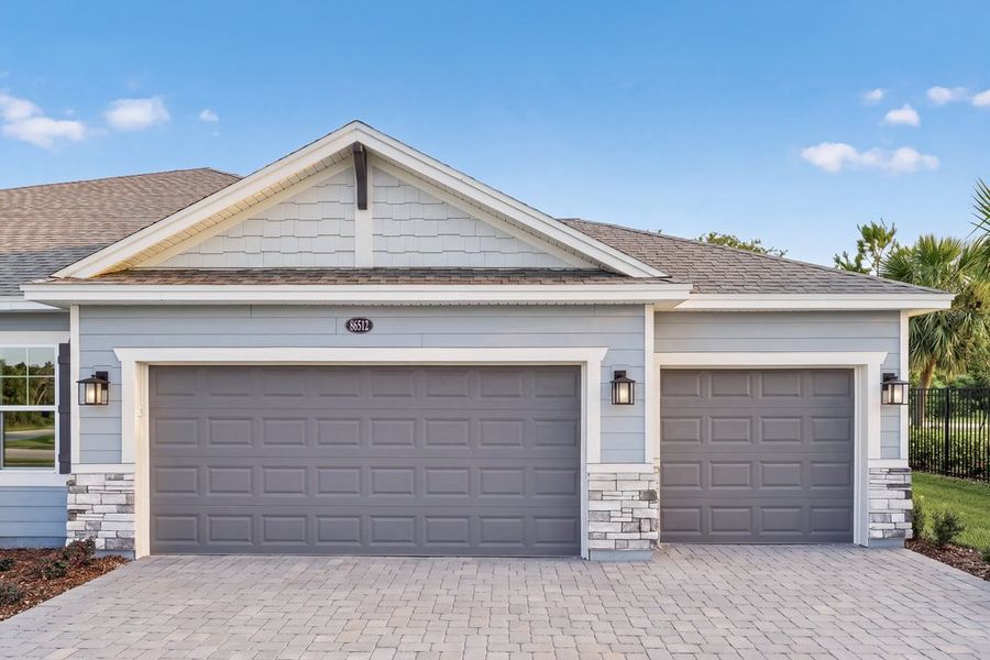 Front exterior of a new home in Headwaters at Lofton Creek, Yulee, FL, highlighting curb appeal (Image 21).