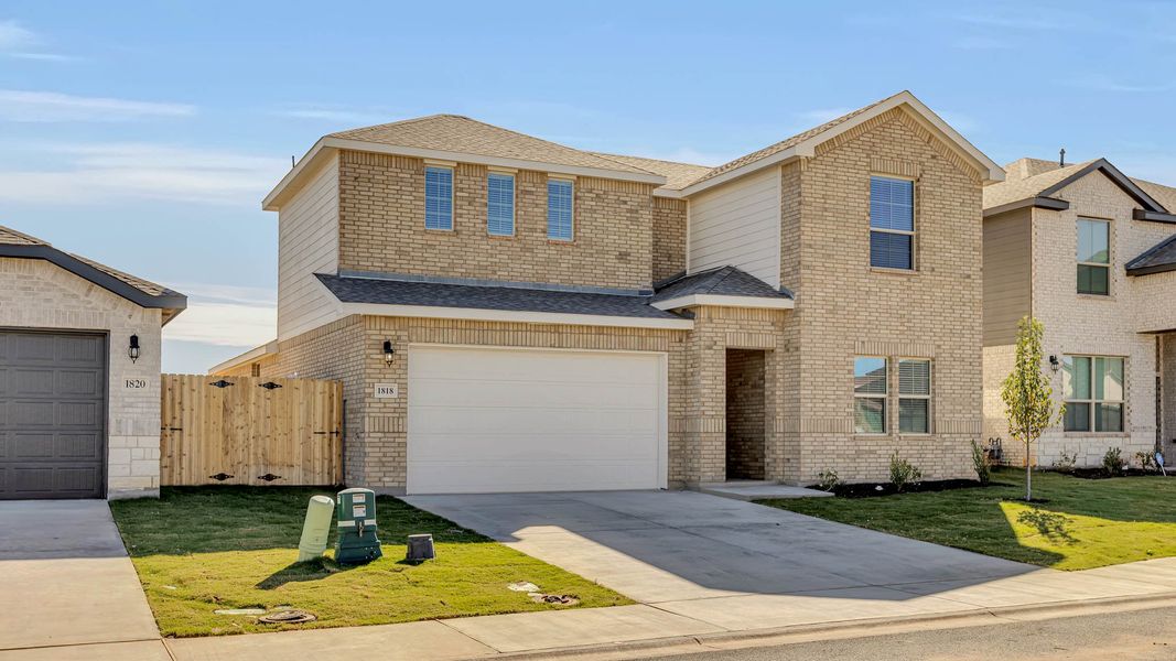 Front exterior of a new home in Northwest Passage, Midland, TX, highlighting curb appeal (Image 14). Front exterior of a new home in Northwest Passage, Midland, TX, highlighting curb appeal (Image 14).
