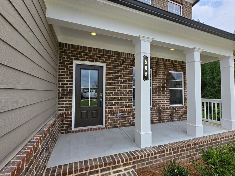 Exterior details and patio area of a home in Enclave at Logan Point, Loganville (Image 4).