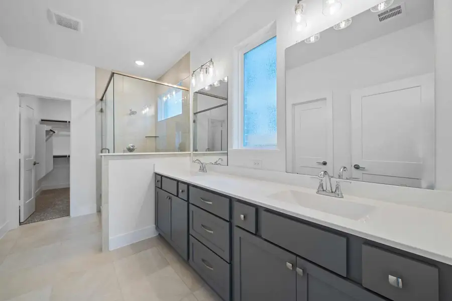 Representative furnished interior of a home built from the Sage by Chesmar Homes in Sunterra, Katy (Image 5).