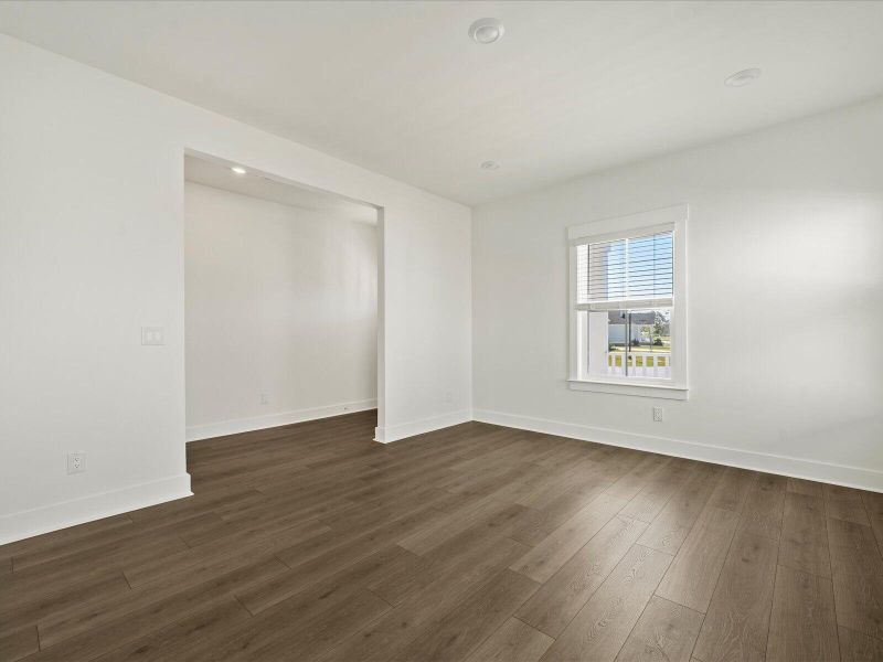 Spacious, unfurnished interior of a new home in The Coves at Lakes of Cane Bay, Summerville (Image 16).