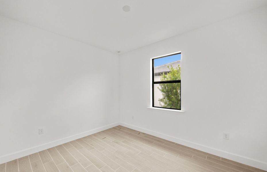 Representative unfurnished interior of a home built from the Concord by DiVosta in Talon Preserve on Palmer Ranch, Nokomis (Image 19).