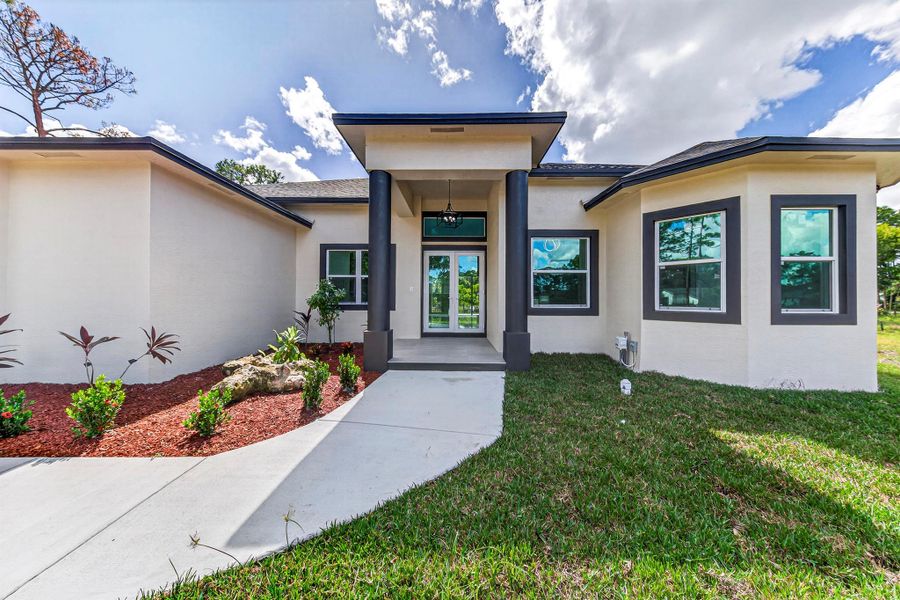 Exterior details and patio area of a home in , The Acreage (Image 33). Exterior details and patio area of a home in , The Acreage (Image 33).